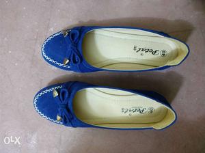 Pair Of Blue-and-beige Loafers