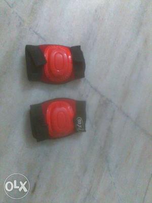 Pair Of Red-and-black Knee Pads