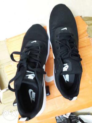 Pair Of White-and-black Nike Sneakers