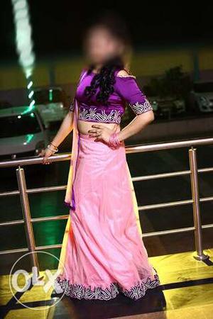 Pink long lehnga with purple crop top and