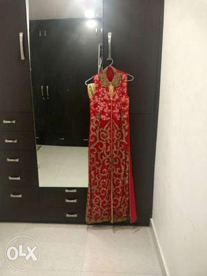 Red embroidered suit with golden skirt