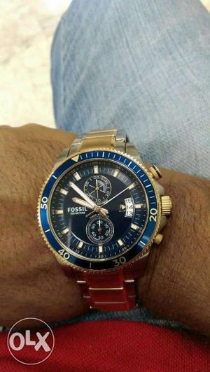 Round Black Faced Fossil Chronograph Watch With Blue Bezel