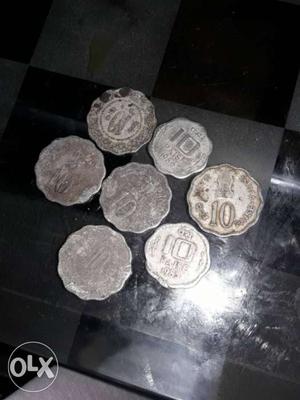 Ten Round Silver Colored Scalloped-edge Coins