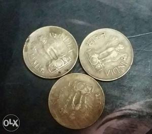 Three Round Silver-colored Coin