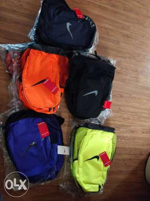 Two Black,orange,blue,and Yellow-green Nike Backpack