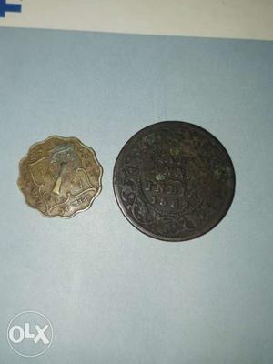 Two Gold-colored And Silver-colored Coins