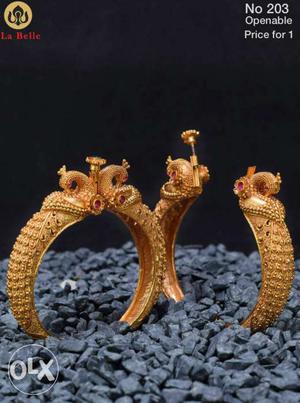 Two Gold-colored Hoop Earrings