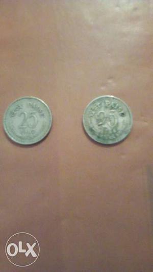 Two Round Silver-colored Indian Paise Coins
