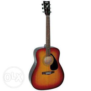 Yamaha f310 acoustic guitar with cover