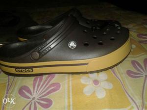 Brown-and-black Crocs Crocband Clogs