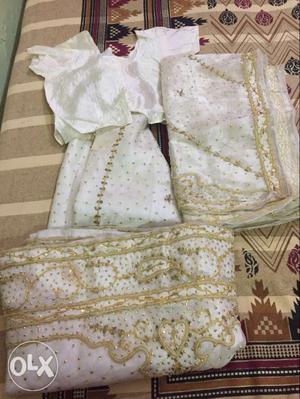 Off white colour lehnga with full ghera and full chunni