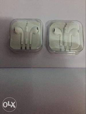 Two Apple EarPods With Clear Cases