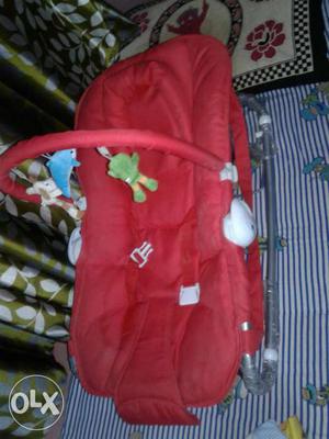 Baby's Red Bouncer Seat