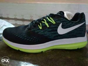 Black, White And Green Nike Shoe