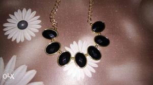 Black stone golden necklace