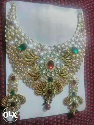 Gold, Ruby, And Emerald Collar Necklace And Chandelier