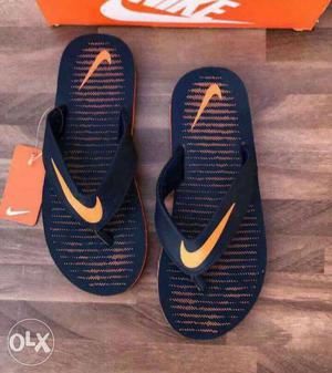 Pair Of Blue Nike Flip Flops With Box