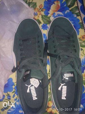 Pair Of Green Puma Low Top Sneakers