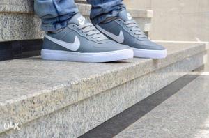 Pair Of Grey-and-white Nike Low-top Sneakers