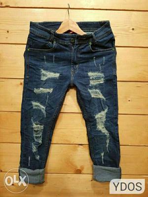Pair Of Tattered Blue Jeans