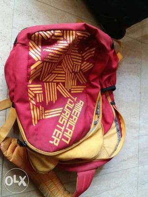Red And Yellow American Tourister Backpack