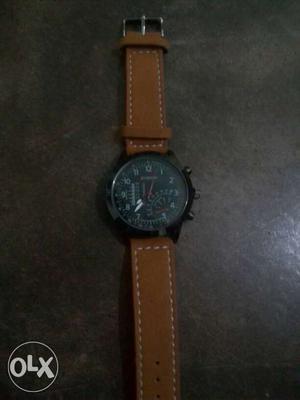Round Black Case Chronograph Watch With Brown Leather Strap