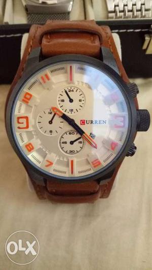Round Black Curren Chronograph Watch With Brown Leather Band