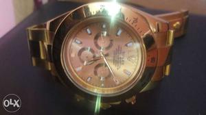 Round Gold-colored Rolex Chronograph Watch With Link