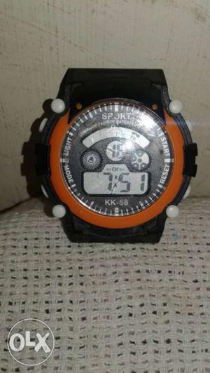 Round Orange And Black Digital Watch With Black Rubber Band