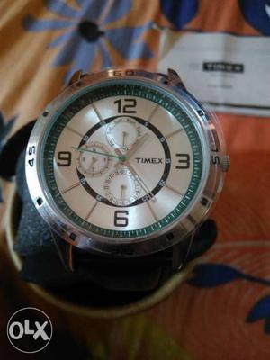 Round White Timex Chronograph Watch With Black Strp