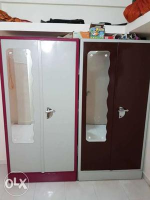 Two Brown-and-white And Pink-and-white Wooden Cabinets