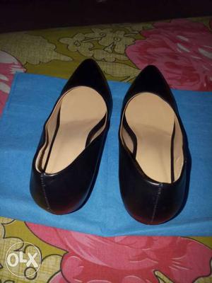 Women's Pair Of Black Leather Flats