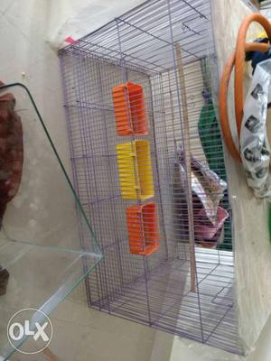 2 and half feet cage with food bowls and breeding