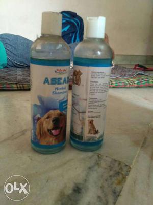 Two Asead Dog Shampoo Bottles