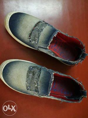 Pair Of Blue Denim Slip-on Shoes