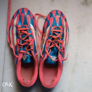 Pair Of Red-and-blue Adidas Cleats