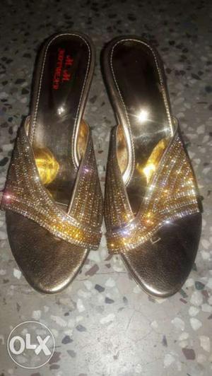 Pair Of Silver-colored And Gold-colored Sandals