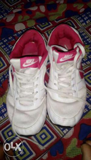 Pair Of White-and-pink Nike Low Tops