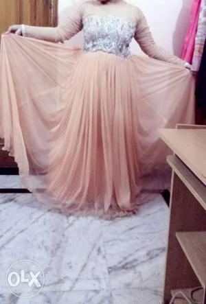 Peach color gown with beautiful embroidery of