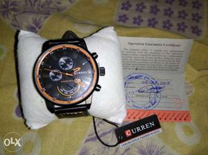 Round Black And Orange Curren Watch