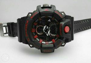 Round Black And Red Chronograph Watch With Black Rubber Band