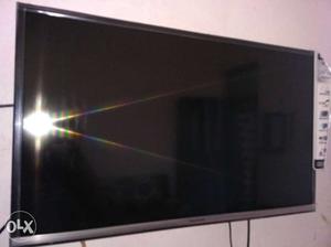 Wall-mounted Gray Flat Screen TV