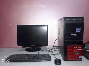 Black Flat Screen Monitor, Keyboard, Gaming Mouse And