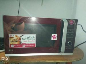 Maroon And Black LG Microwave Oven