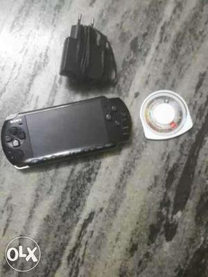 Psp with 2 CD plus charger..urgent sale fixed