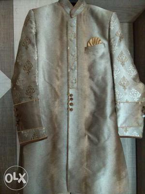 Gold-colored Floral Sherwani Suit