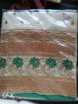 Green, Brown, And White Floral Textile With Pack