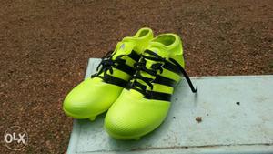 Green adidas football shoe (boot)