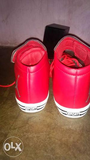 Pair Of Red High Top Sneakers