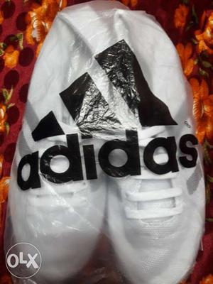 Pair Of White Adidas Shoes